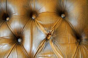 Warm brown button-tufted leather detail