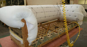 A sofa during the upholstery process in the workshop